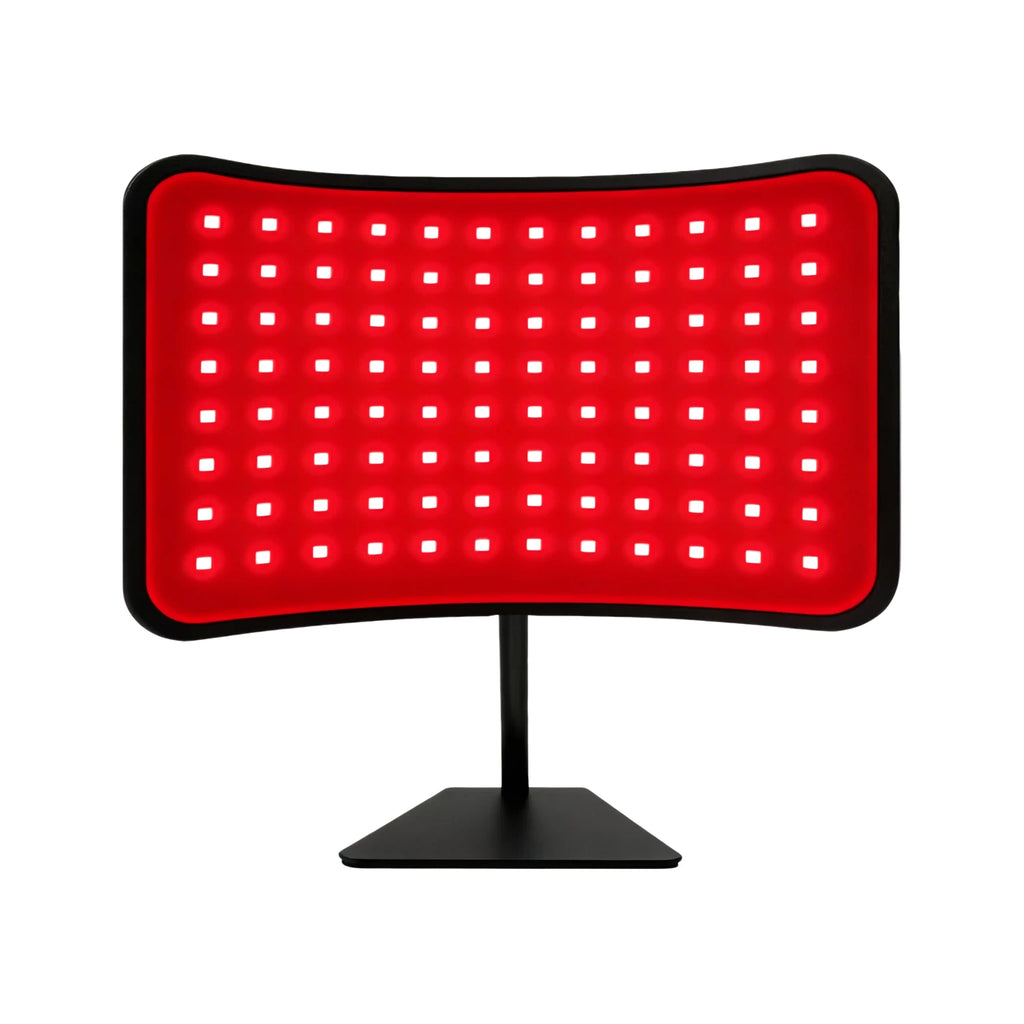 Katalyst 2-in-1 red light therapy lamp — curved desktop LED panel on adjustable black stand, white background product shot.