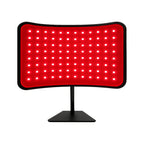 Katalyst 2-in-1 red light therapy lamp — curved desktop LED panel on adjustable black stand, white background product shot.